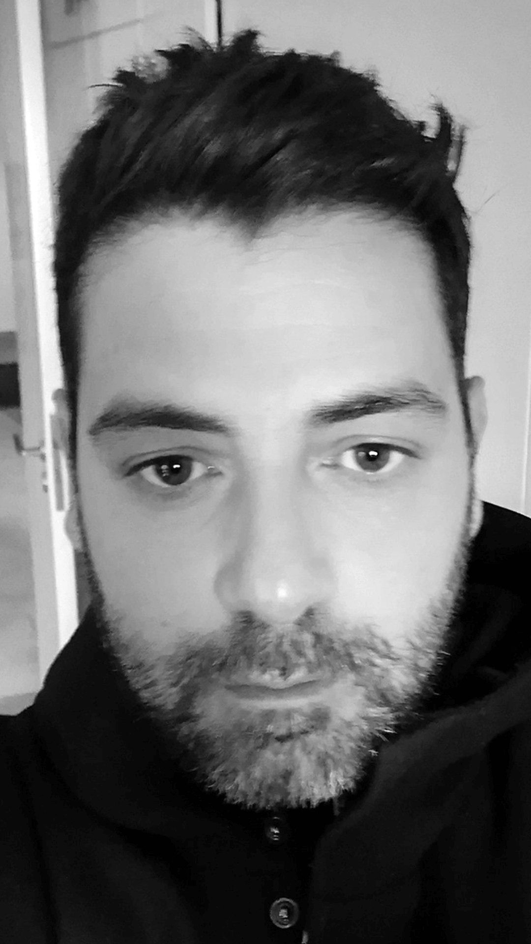 Pandelis Diamantides portrait in black and white, close-up